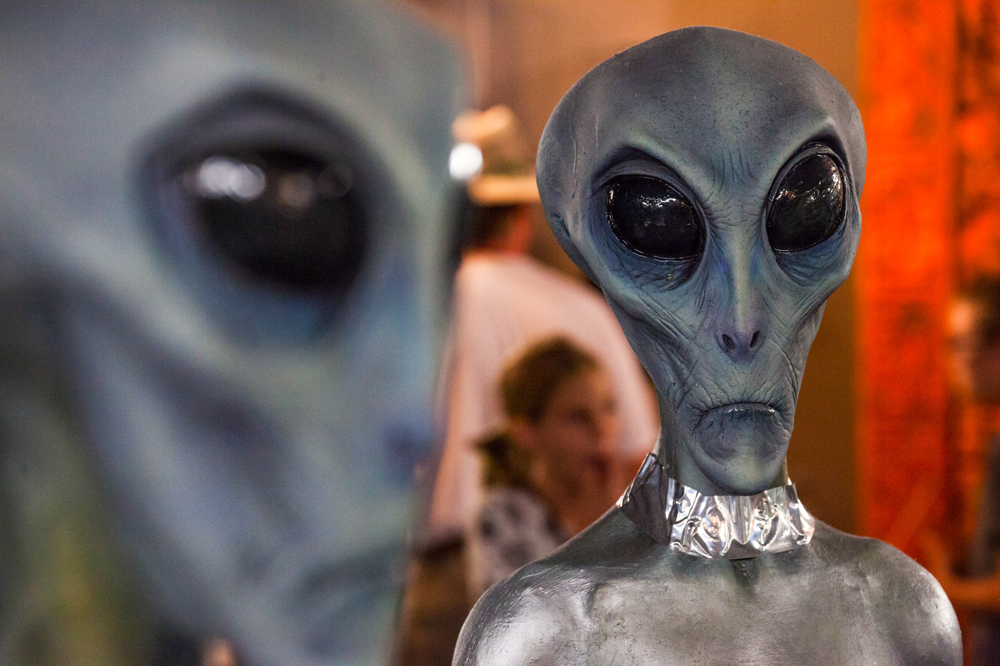 A model of two alien sculptures stand side by side