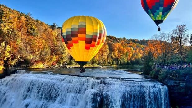 Hot air balloons flying above the waterfalls at Letchworth State Park