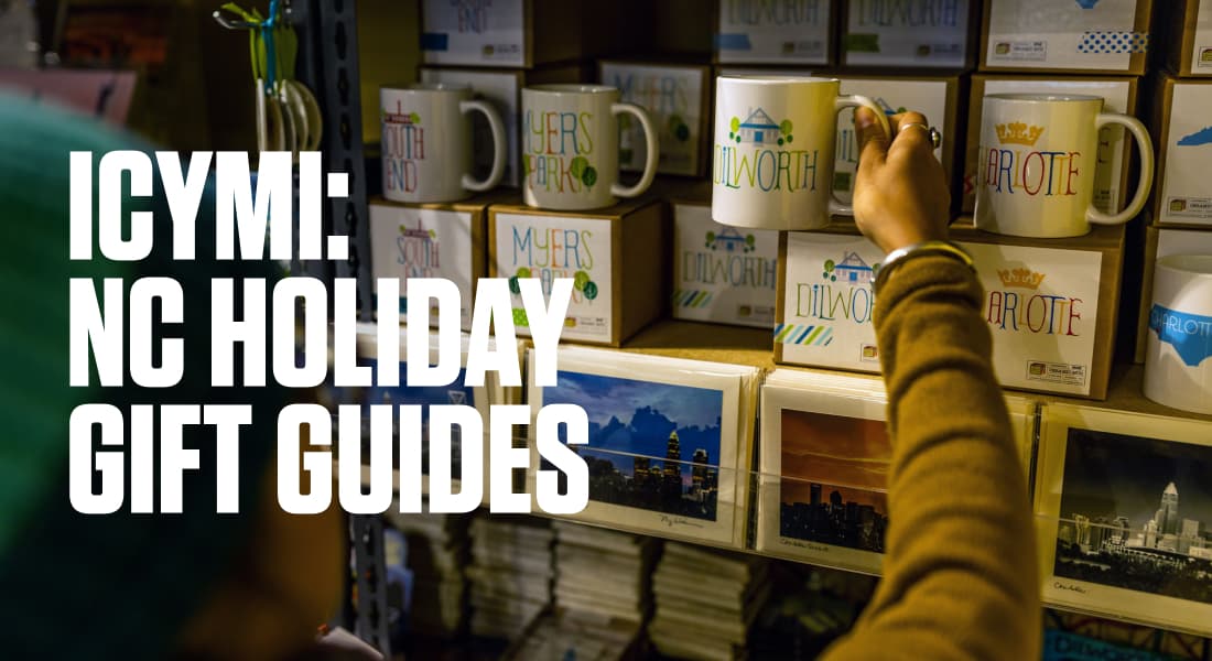 ICYMI: NC HOLIDAY GIFT GUIDES - Woman Looking at Neighborhood-Themed Coffee Mugs in Paper Skyscraper