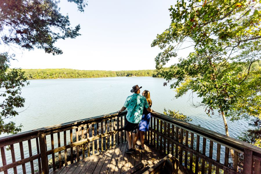 A man and a woman on a dock at Lake Norman.