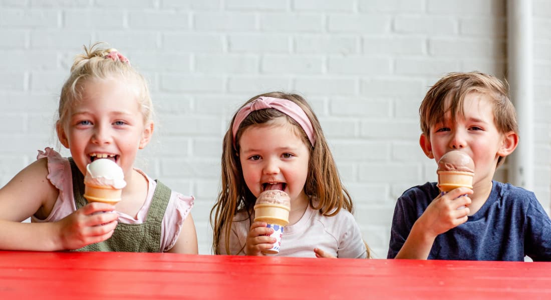 Three children enjoying ice cream together - Whit's Frozen Custard, Hendersonville NC
