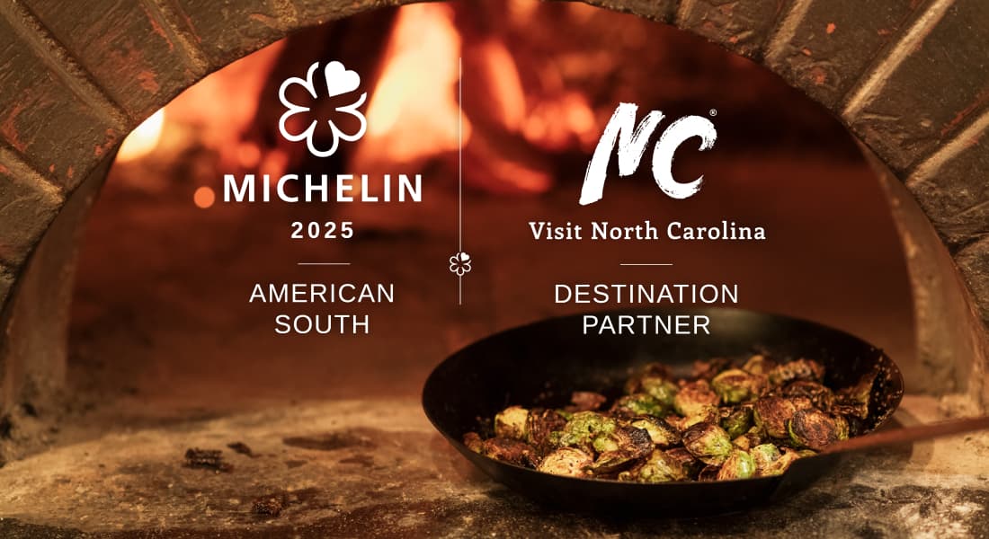 Michelin 2025 - Skillet of food heating up in front of wood-fired oven at Supperland in Charlotte, NC
