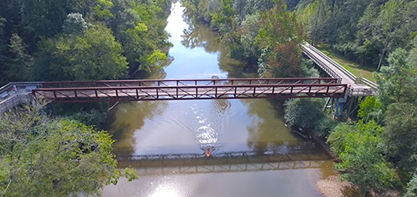 Aerial photo of a bridge and kayaker on the Neuse River in Johnston County, NC. 