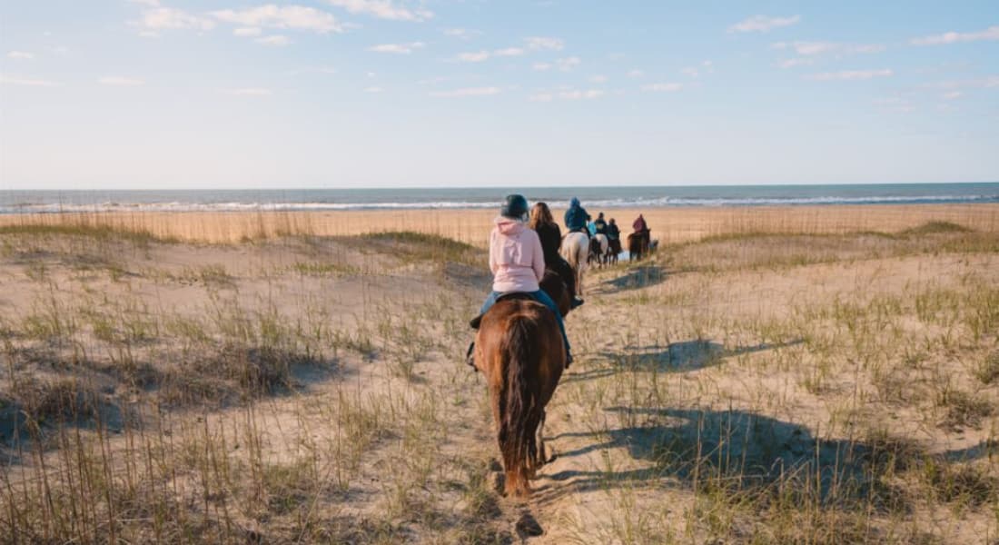 Horse riders on the dunes of the Outer Banks, NC
