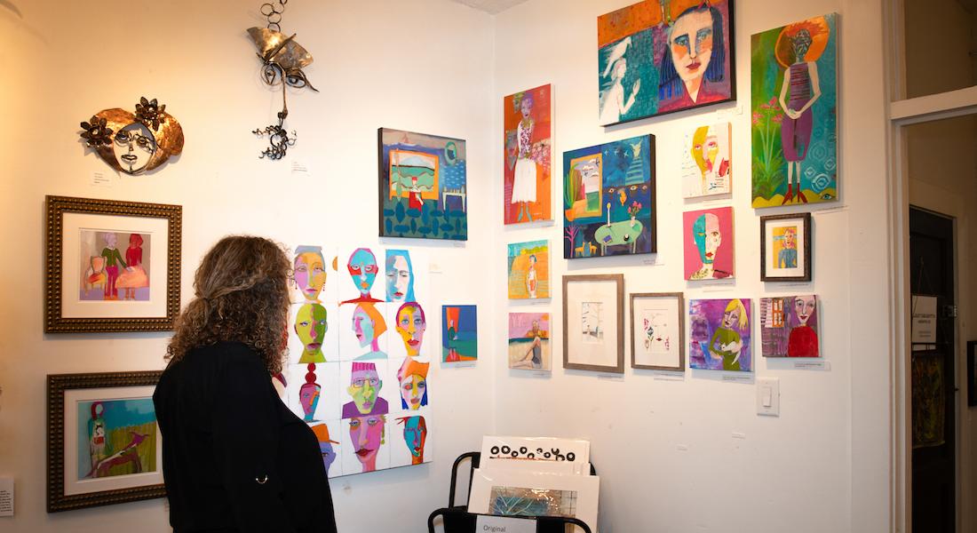 Woman viewing  artwork at Hillsborough Gallery of Arts, Hillsborough NC
