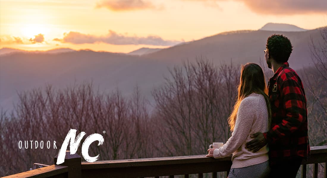 OUTDOOR NC - couple watching the sun set over the NC mountains