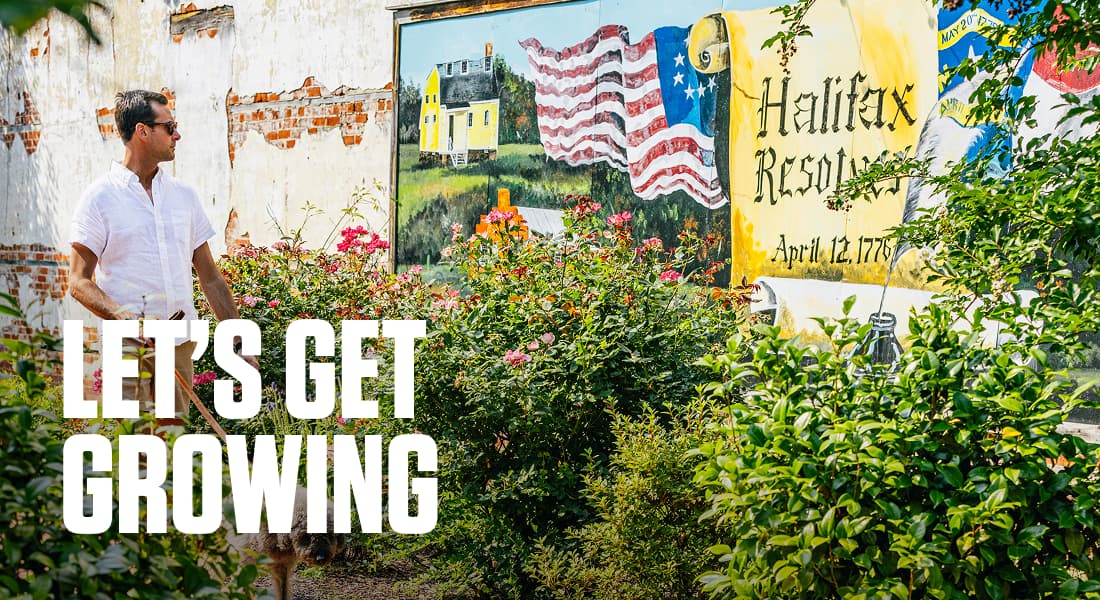 LET'S GET GROWING - Ryan Stancil walks through the alley beside the Hen and the Hog depicting the Halifax Resolves, Halifax NC