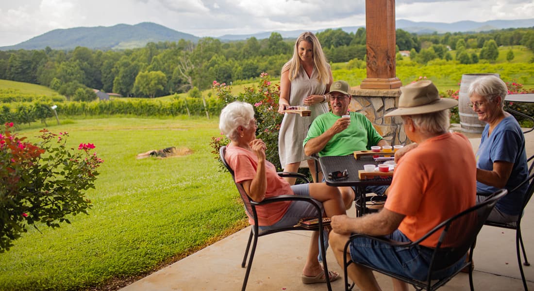Wine tasting on an outdoor patio at Round Peak Vineyards, Mt. Airy, NC
