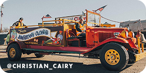 Red old-fashioned fire truck, with text overlay that reads @christian_cairy