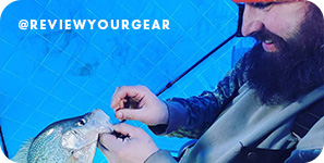 Bearded man removing a hook from a fish's mouth, with overlay text that reads @reviewyourgear