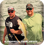 Two men holding a fishing rod and a fish in front of water, with overlay text that reads @latendresse_guide_service