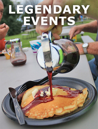 Close-up of a hand pouring syrup on pancakes, with overlay text that reads: Legendary Events