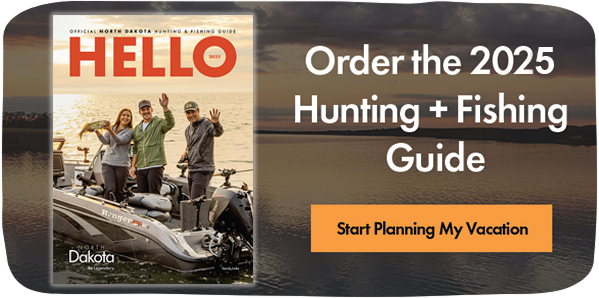 Image of a travel guide cover with people on a boat and text that reads: Order the 2025 Hunting + Fishing Guide. Start Planning My Vacation