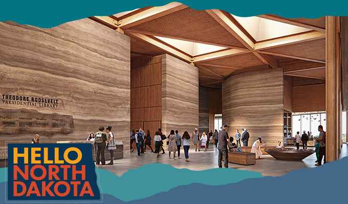 Interior of the Theodore Roosevelt Presidential Library featuring people in a lobby with a stone and wood design, with overlay text that reads: Hello North Dakota
