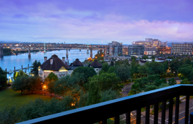 View from a balcony overlooking the Portland waterfront at dusk.
