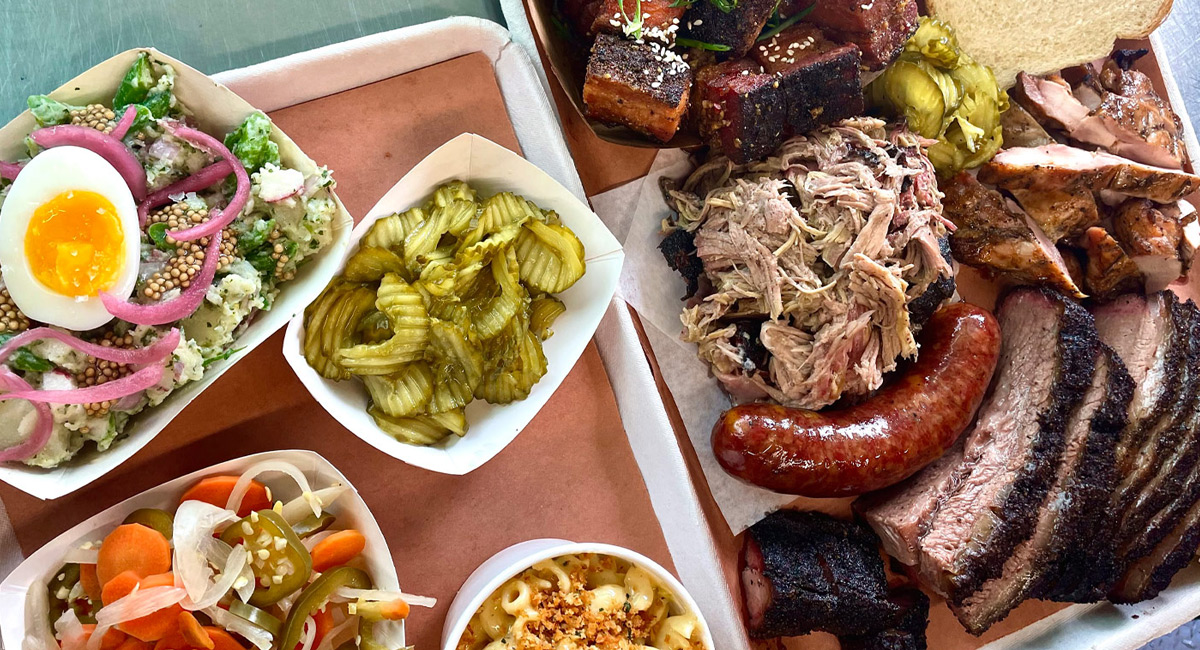 Plates of BBQ meats and the fixings.
