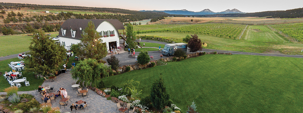Aerial view of a winery estate, including barn room and outdoor seating.
