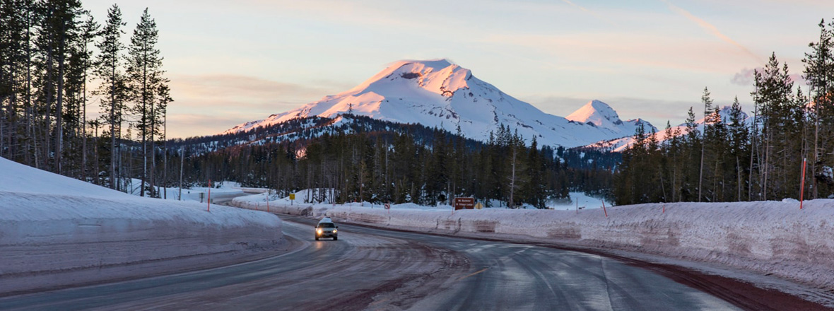 Snow surrounds the road to Mt. Bachelor.