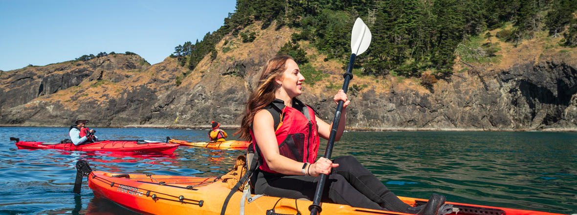 A woman on a group kayaking tour.