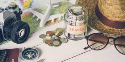 Money on table planning a trip