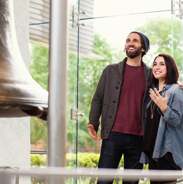 Two people admiring Liberty Bell