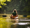 Person canoeing on lake
