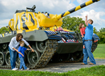 Family playing with large display machine