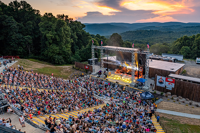 Open air concert venue with seats filled by people