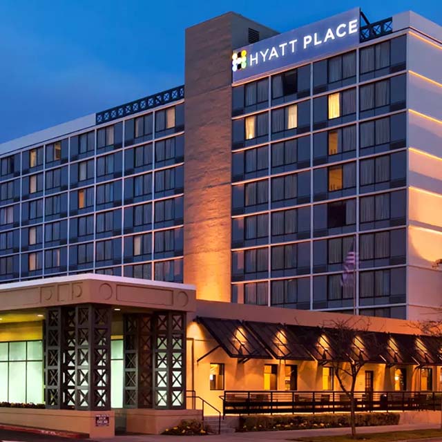 Frontal view of the Hyatt Place San Jose Downtown in the evening.