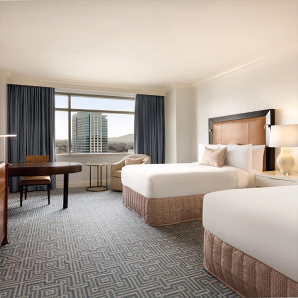 The interior of a clean hotel room at the Signia by Hilton hotel.