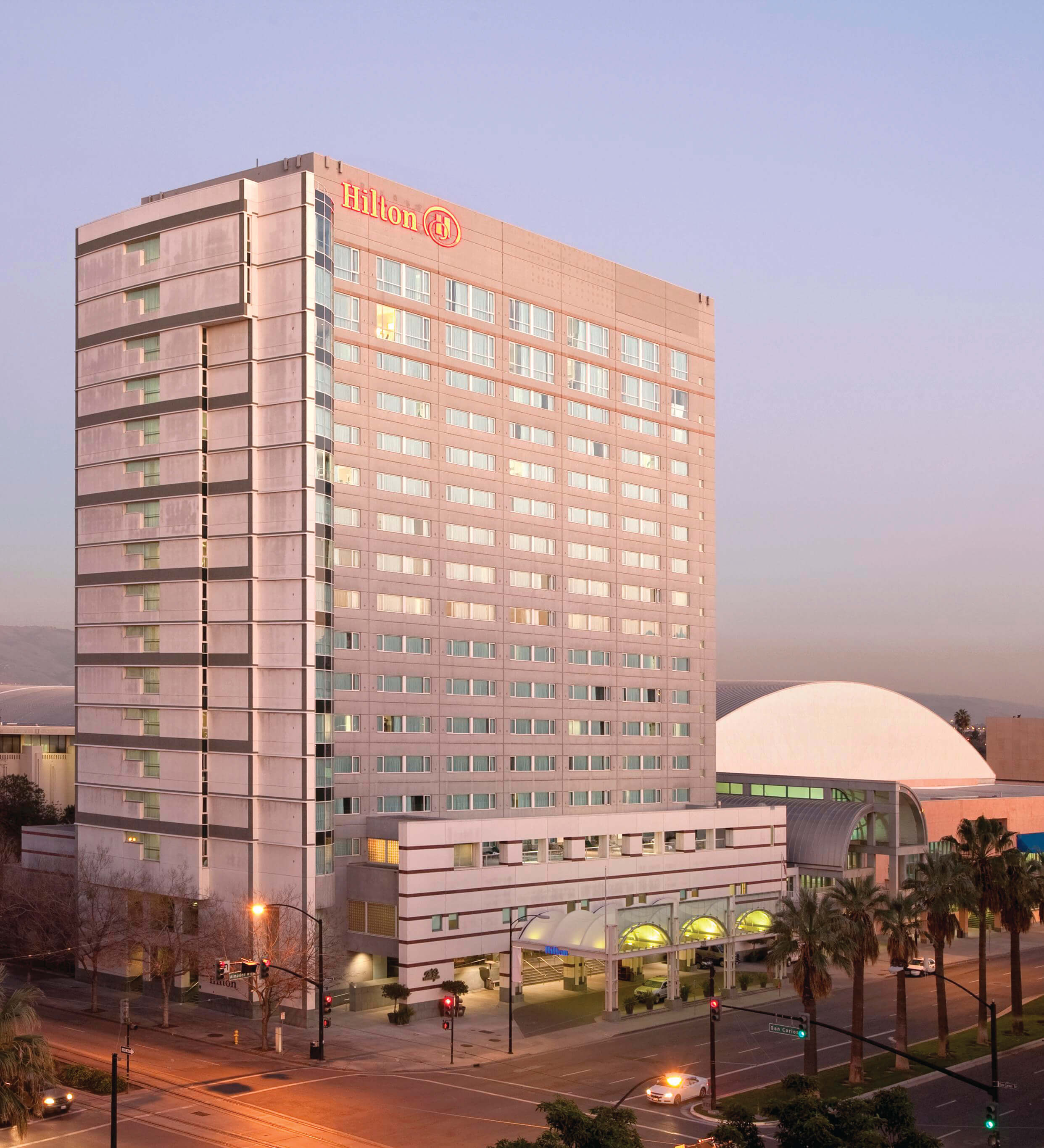 Hilton San José exterior at dusk.