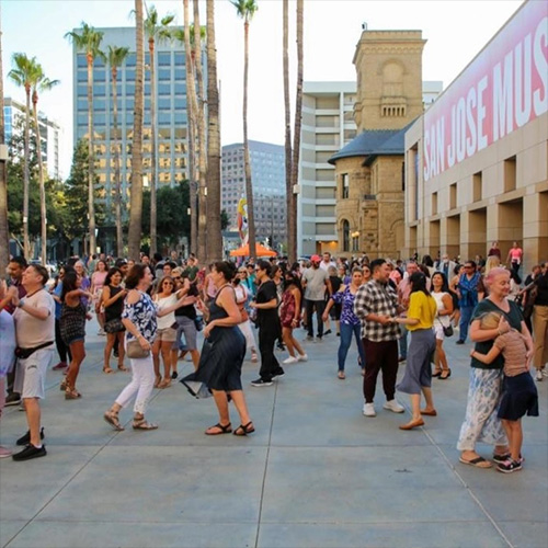 A street filled with people dancing at the CityDance San José event.
