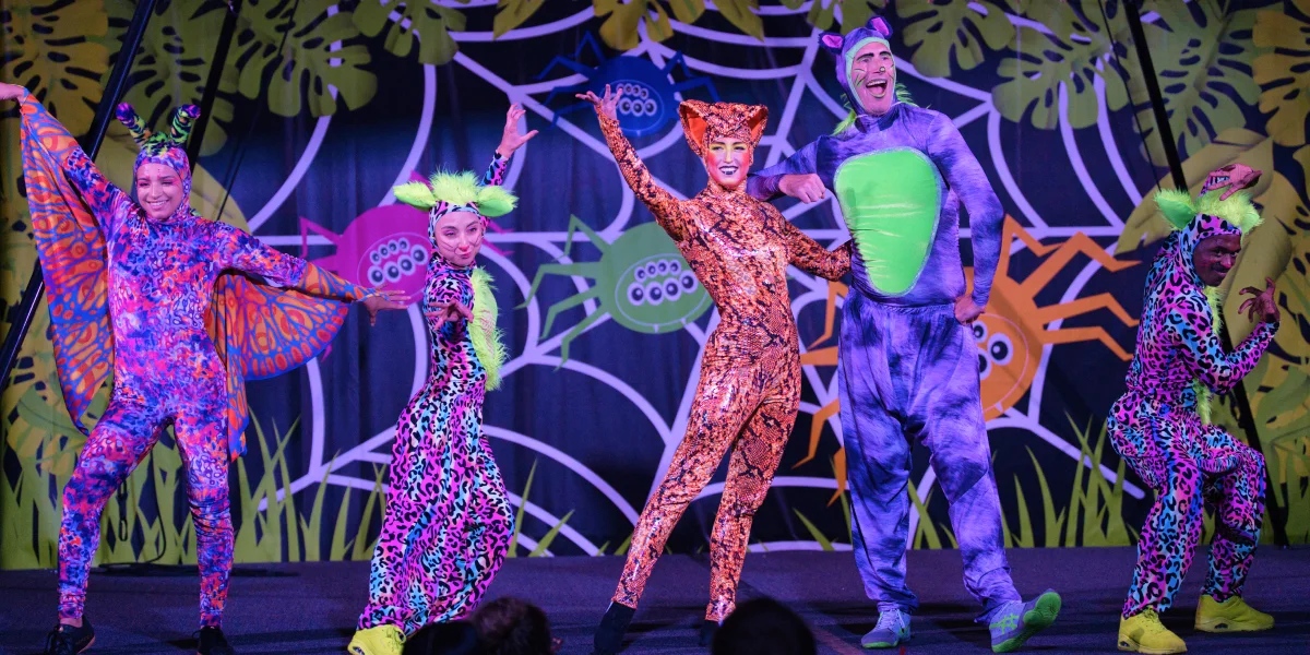 Performers in glow costumes