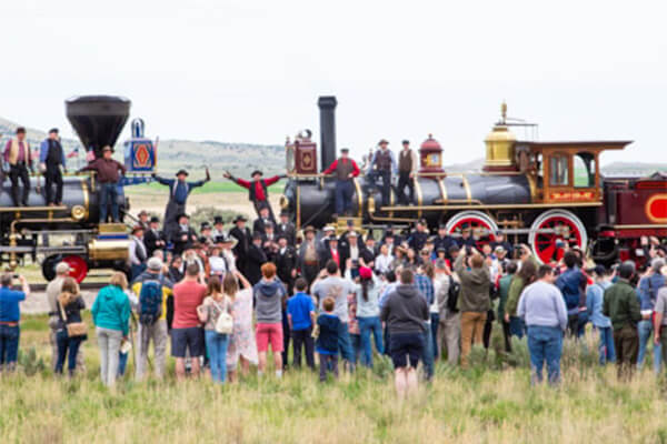 people standing in front of a train