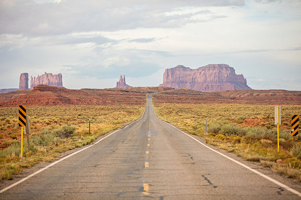 a road leading to rock formations in utah