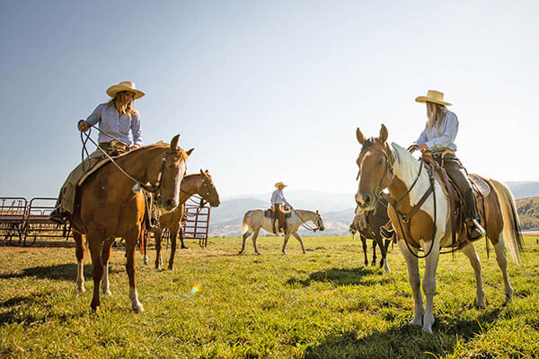 people riding on horses at a utah dude ranch