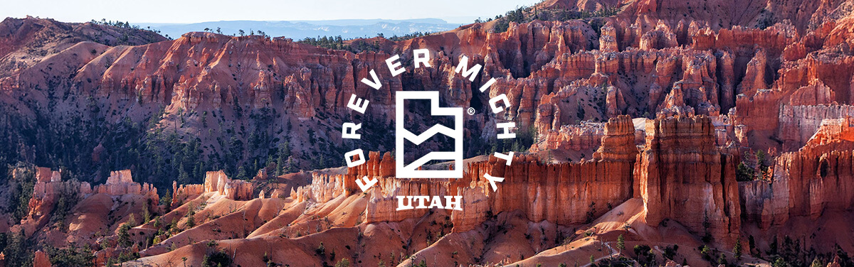 a view of bryce canyon with a white overlay that reads forever mighty