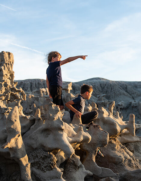 two kids exploring the fantasy-like landscape in vernal