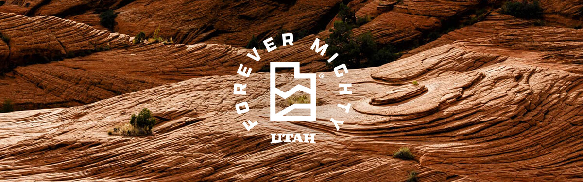 rock formations with an overlay that says forever mighty