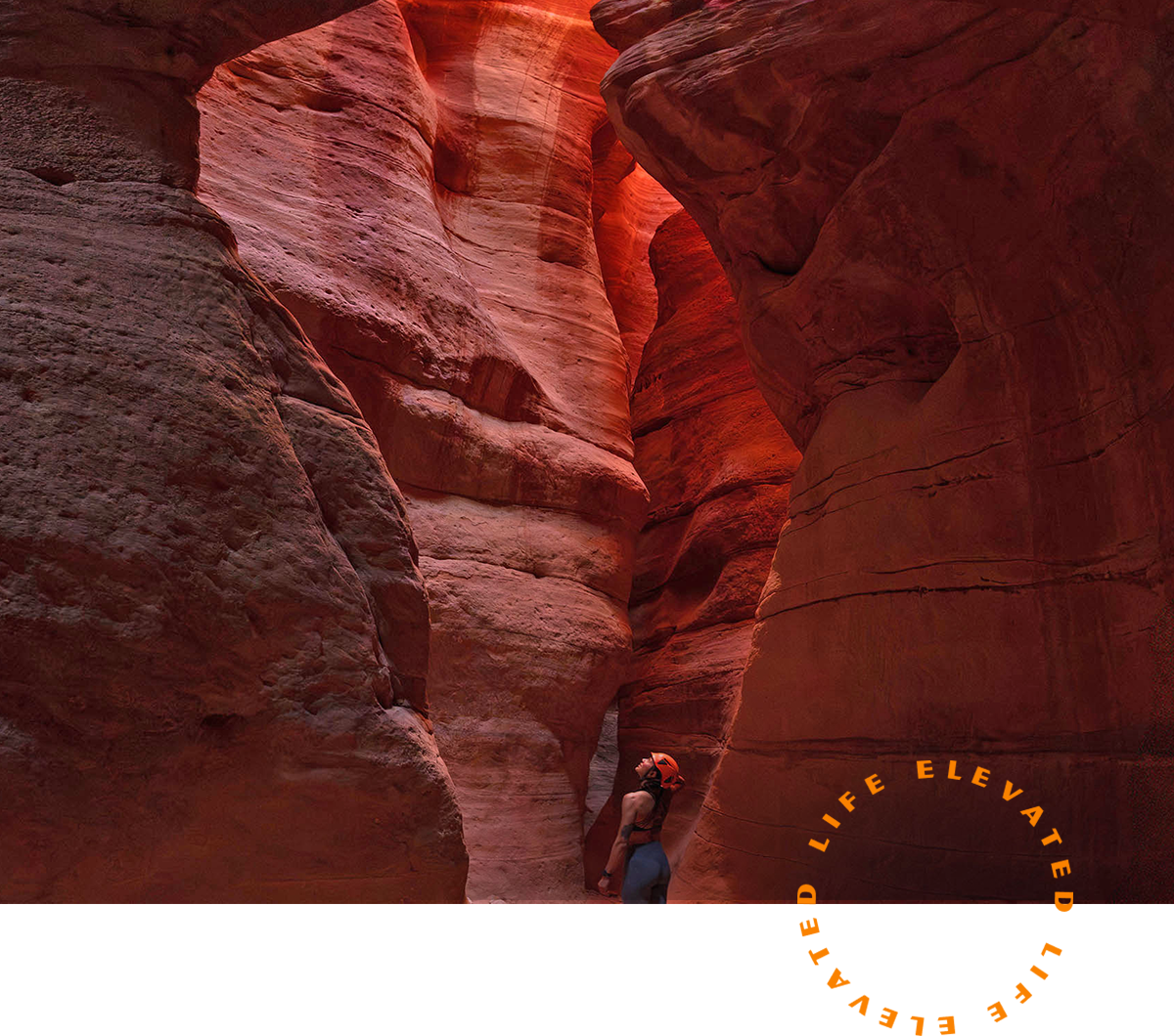 A person standing in the middle of canyon walls