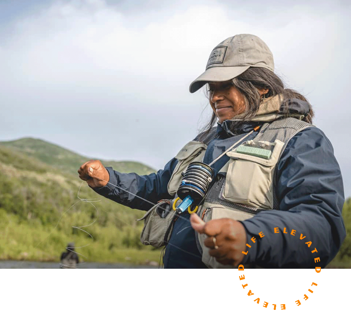 A woman holding a fishing line.