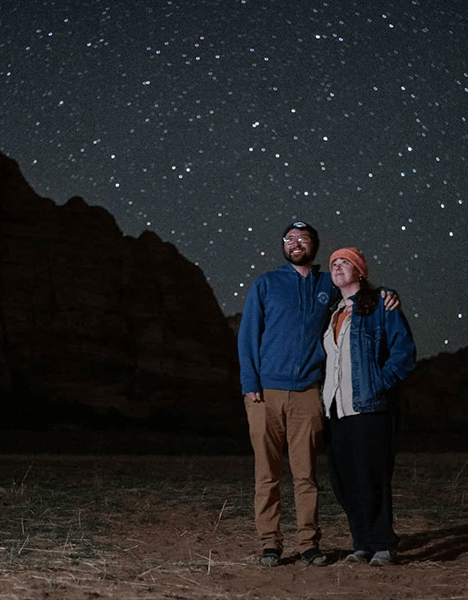 a couple stargazing at a park in utah