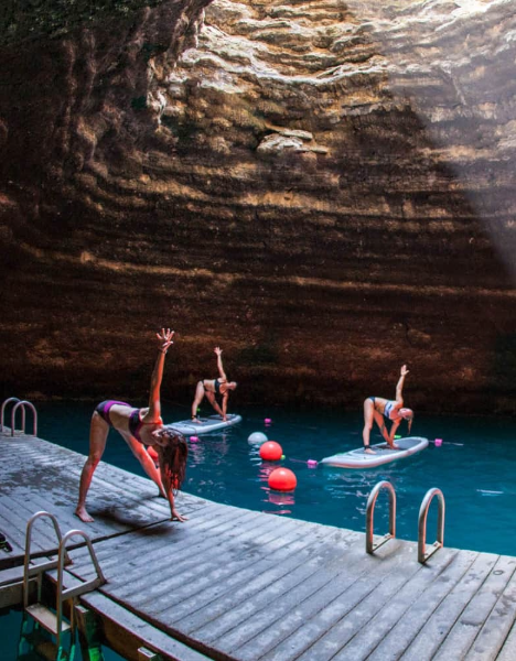a group of people floating in a pool