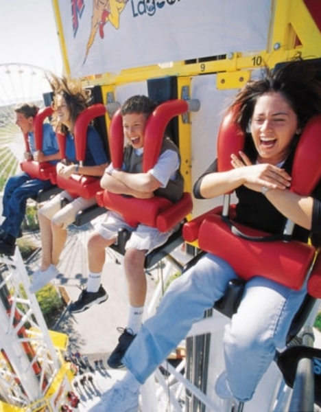 a group of people riding on a roller coaster