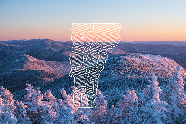 Snowy mountains at sunset with light reflecting, seeming to make them glow. Overlaid is a graphic of the state of Vermont with 14 regions outlined.