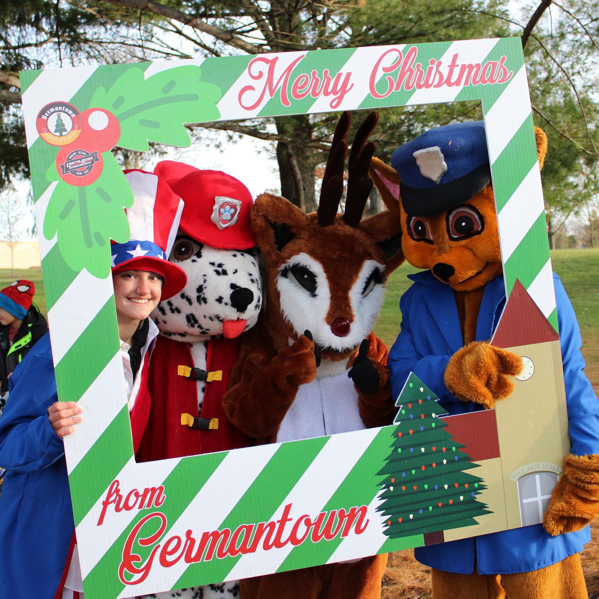 Characters getting their photo taken at christmas festival