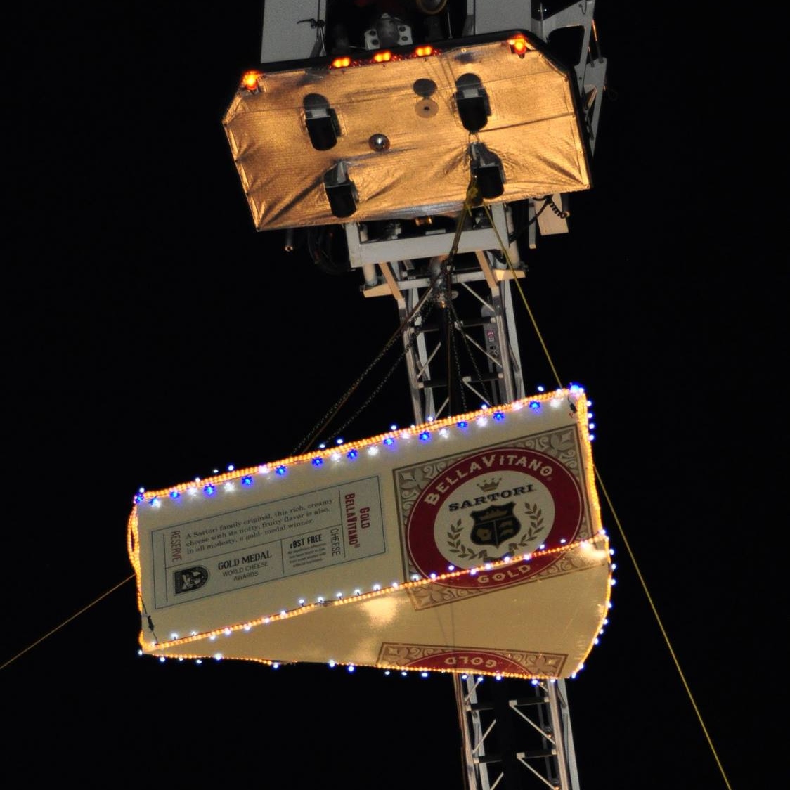 Giant cheese wedge being lowered for New Years Eve