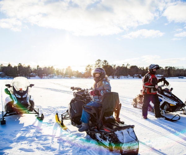 friends snowmobiling 