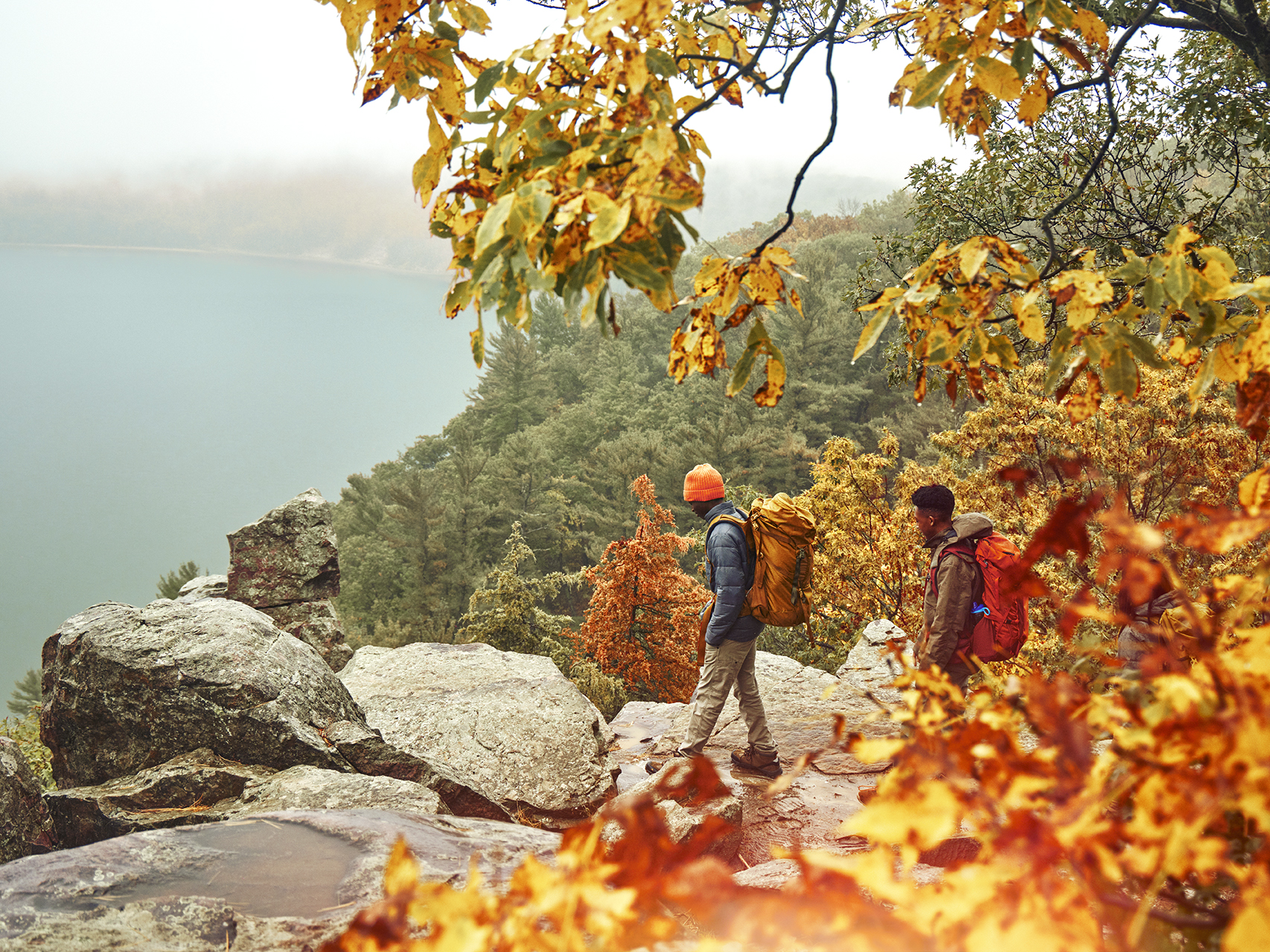 two boys hiking at devils lake state park in the fall