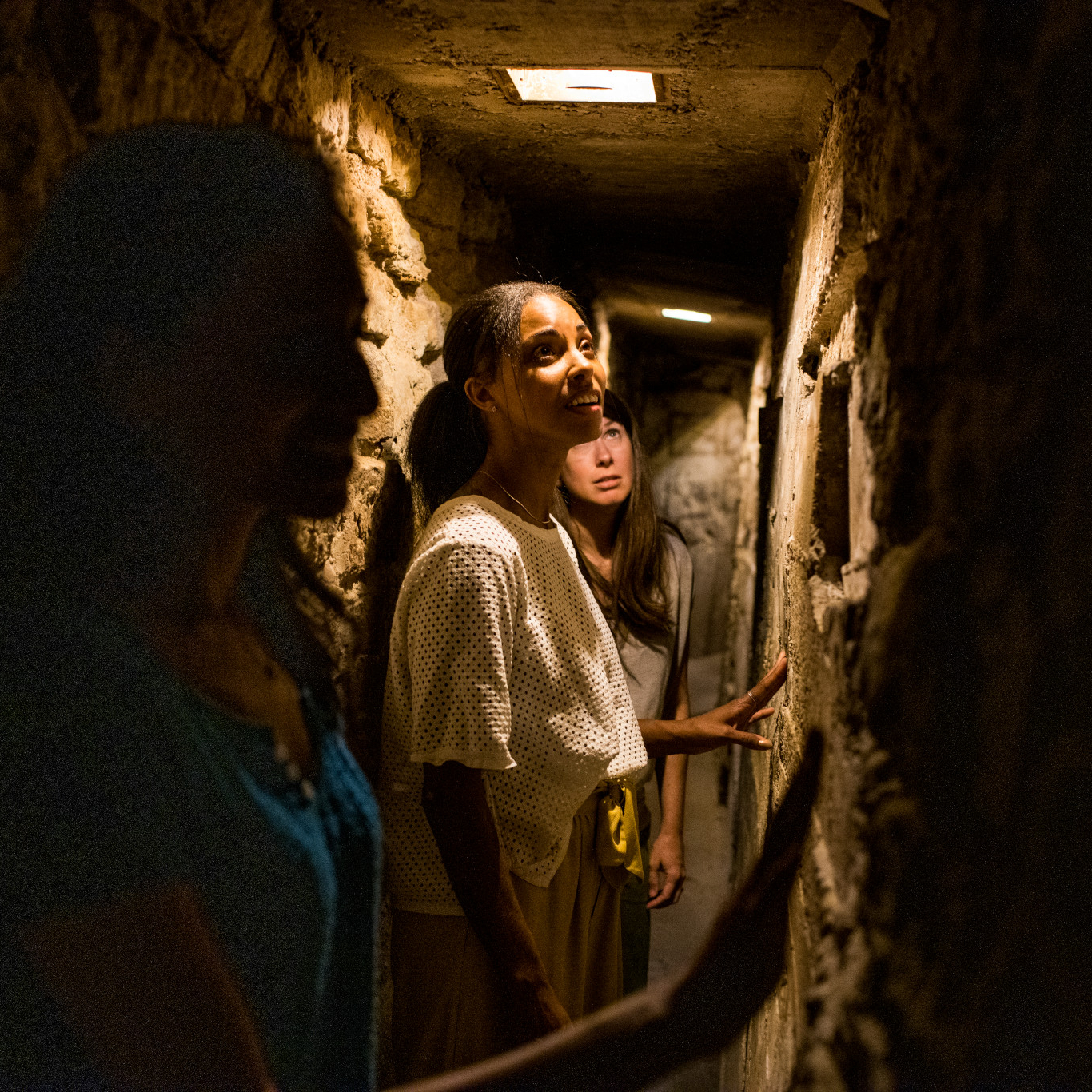 group of women on underground railroad tour at Milton House 